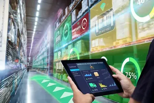Tablet displaying inventory charts with digital data overlaid on a warehouse aisle
