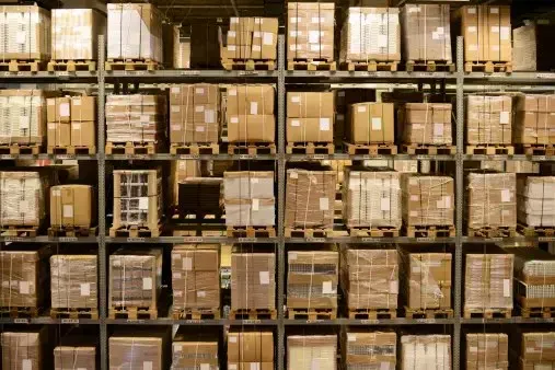 Pallets of boxed inventory stored on warehouse racks