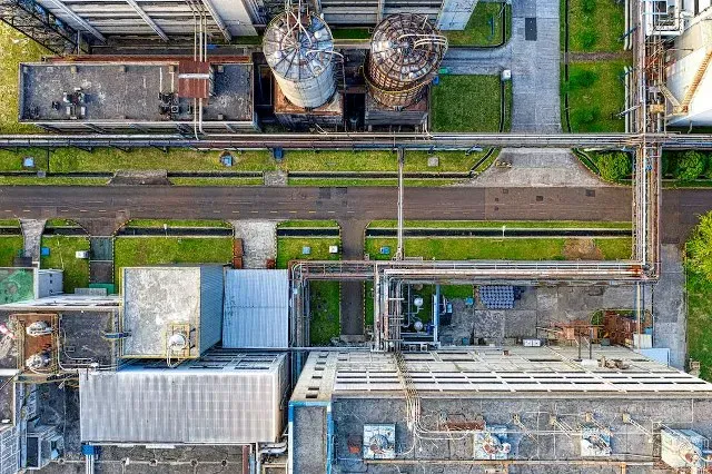 Aerial view of an industrial facility with tanks and pipelines